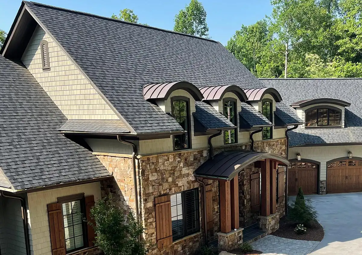 Gutters and downspouts across multiple residential rooflines